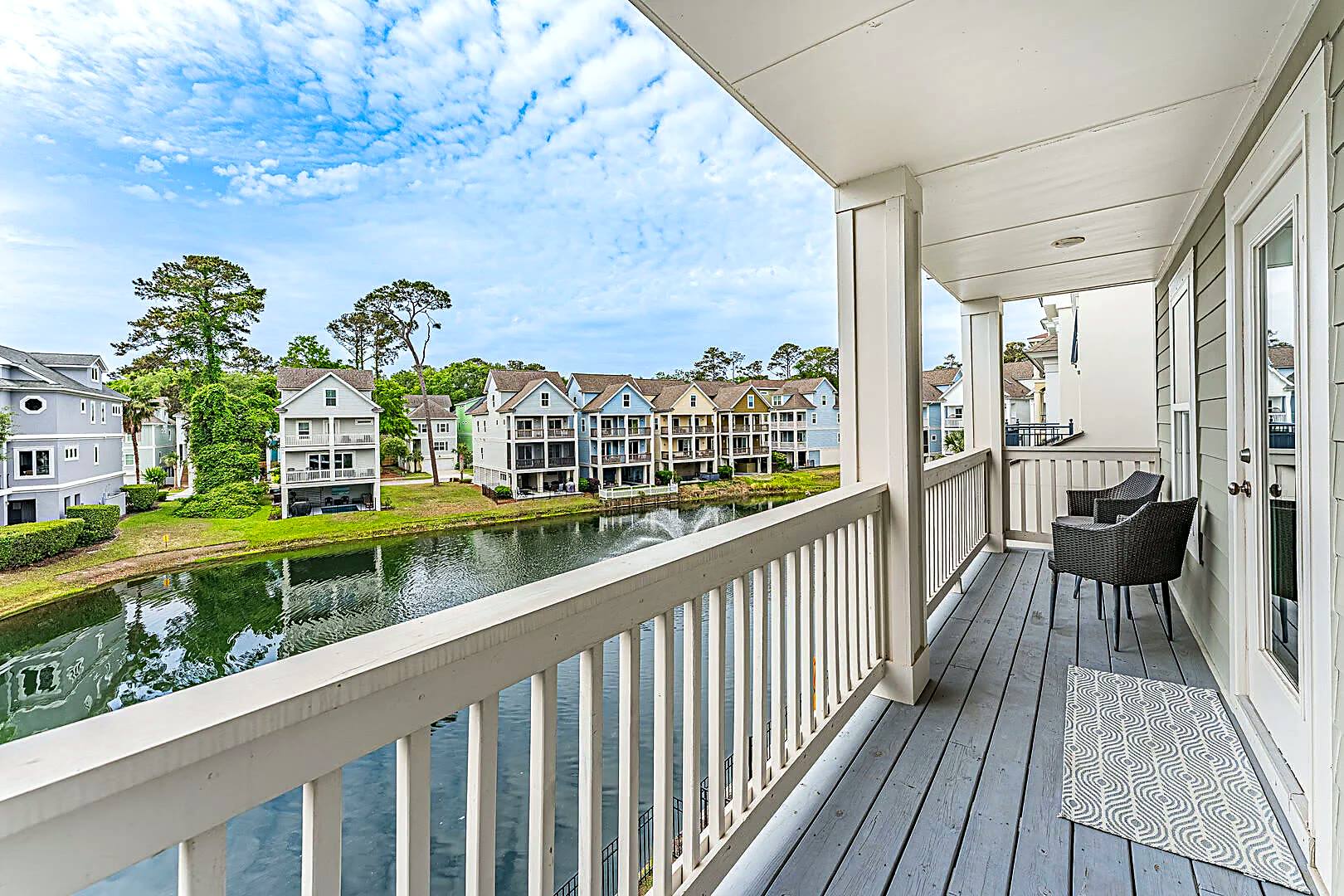 Upper floor balcony at 122 Sandcastle Court looking down the lagoon toward the fountain