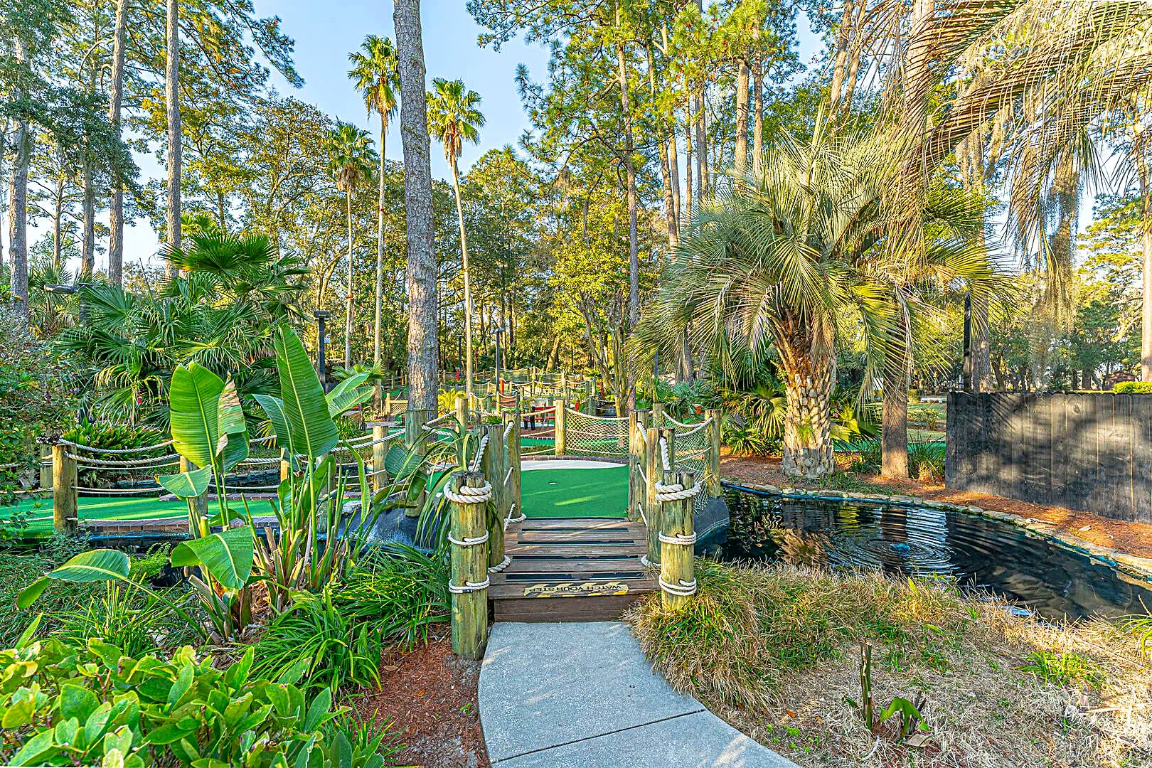 Mini golf course with rope bridges and tropical planting at Adventure Cove, Hilton Head Island