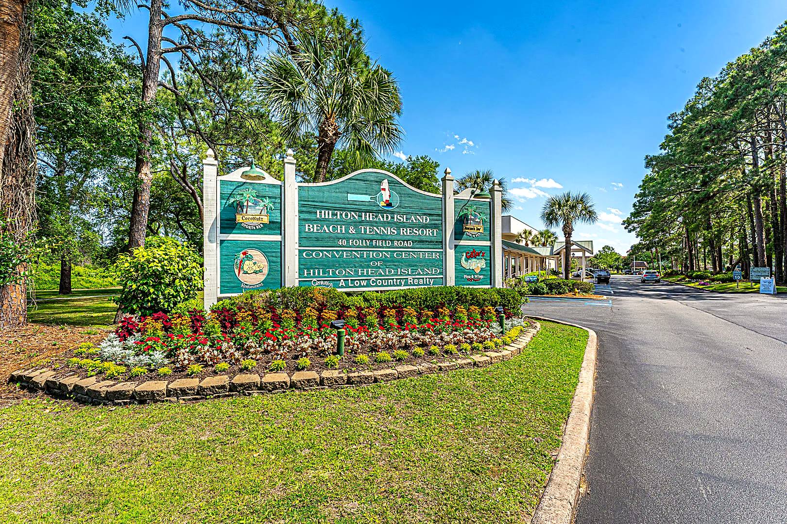 Entrance sign for Hilton Head Island Beach and Tennis Resort at 40 Folly Field Road, listing CocoNutz Sportz Bar, Jamaica Joe'z and Gator'z Pizza